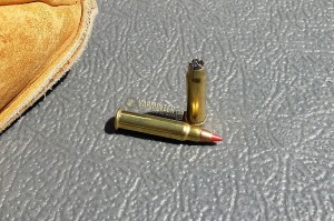 A cracked neck and powder stuffed at the top of the .17HMR case.